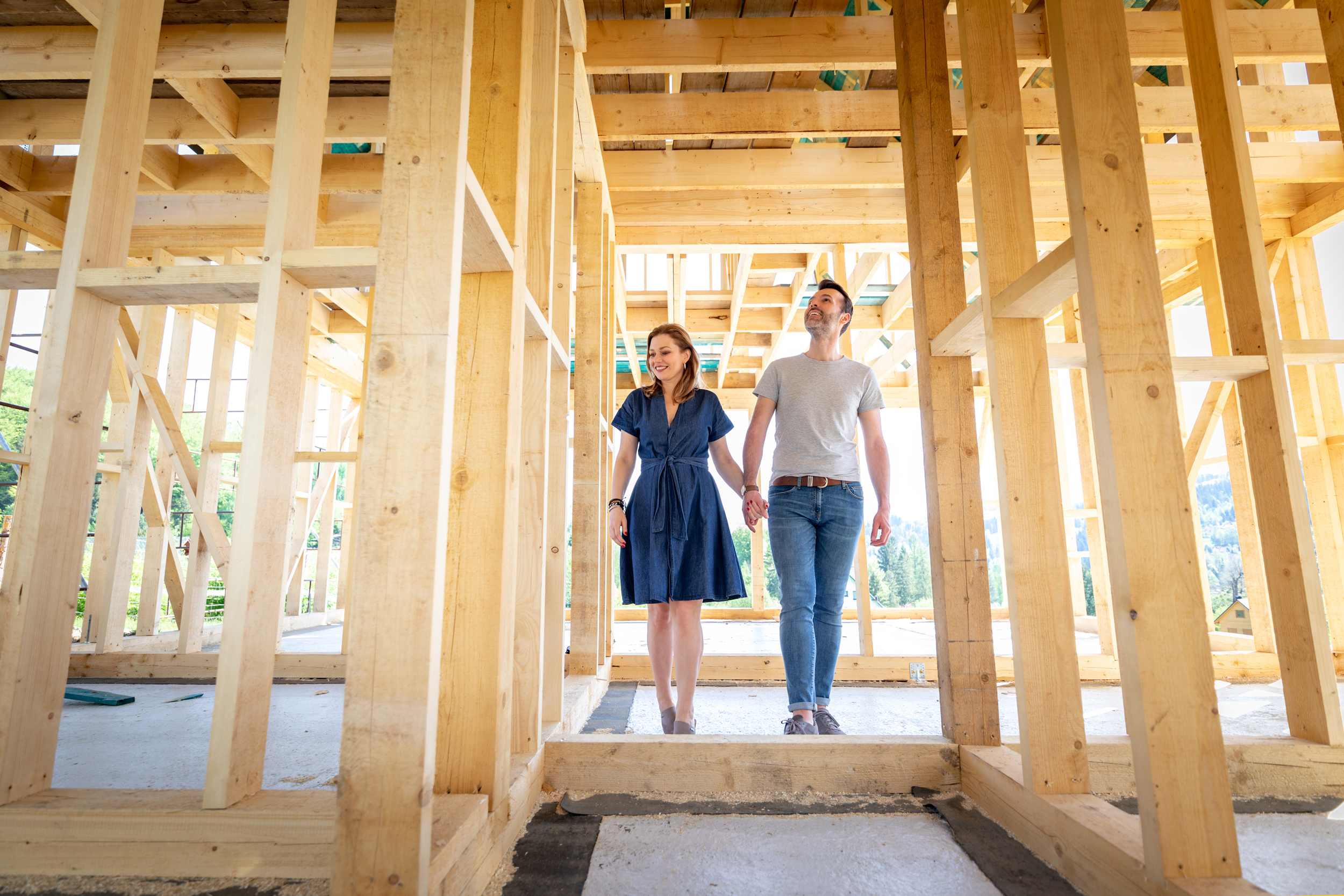 Couple walking through construction of new home
